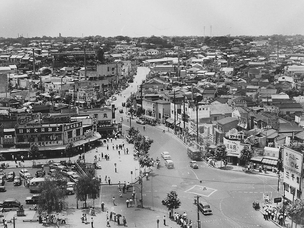 Bustling cityscape of Tokyo near Shinjuku Station in 1952 Black-and-white photograph of a Tokyo cityscape near Shinjuku Station in 1952.