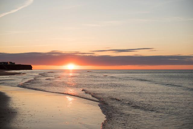 Photo of a beach at sunset on PEI.