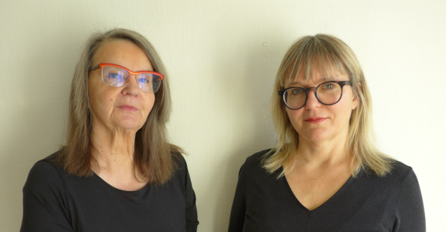 Eva Ström and her daughter Anna Vogel. Photo by Helge Ström. Image courtesy of Aglaktuq. Two women with glasses and black shirts.
