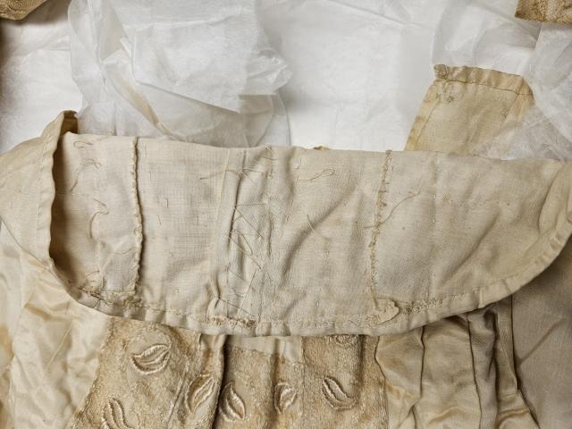 Ives waist Roughly hand-stitched and basted interior of the ivory silk and lace waist of Mrs. T.G. Ives, worn in September 1910.