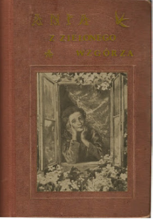 Ania z Zielonego Wzgórza 1911/1912 Cloth book cover of Ania z Zielonego Wzgórza with pastedown picture. Anne is looking out of a window and is surrounded by leaves and flowers.