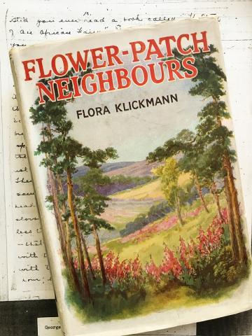 Painted book cover of Flower-Patch Neighbours against written text. The book cover depicts farmland with trees and flowers.