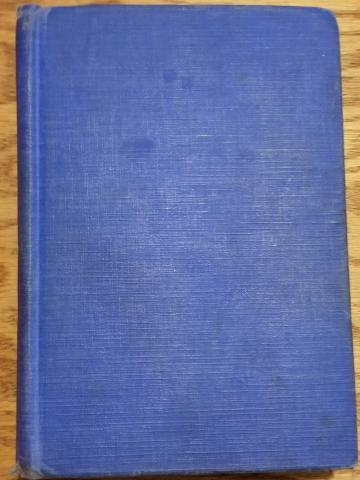 Jones Image 1 A photograph of a hardback book with a plain blue cover and no dust jacket.